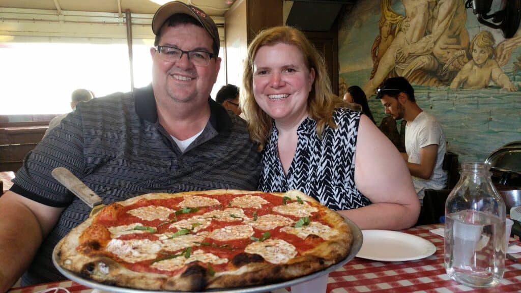 photo of bobby and wendi warren enjoying pizza at Lombardi's
