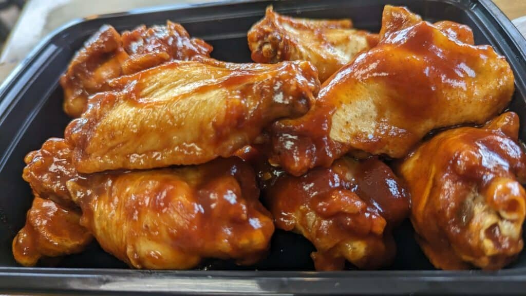 photo of fried chicken wings with BBQ sauce