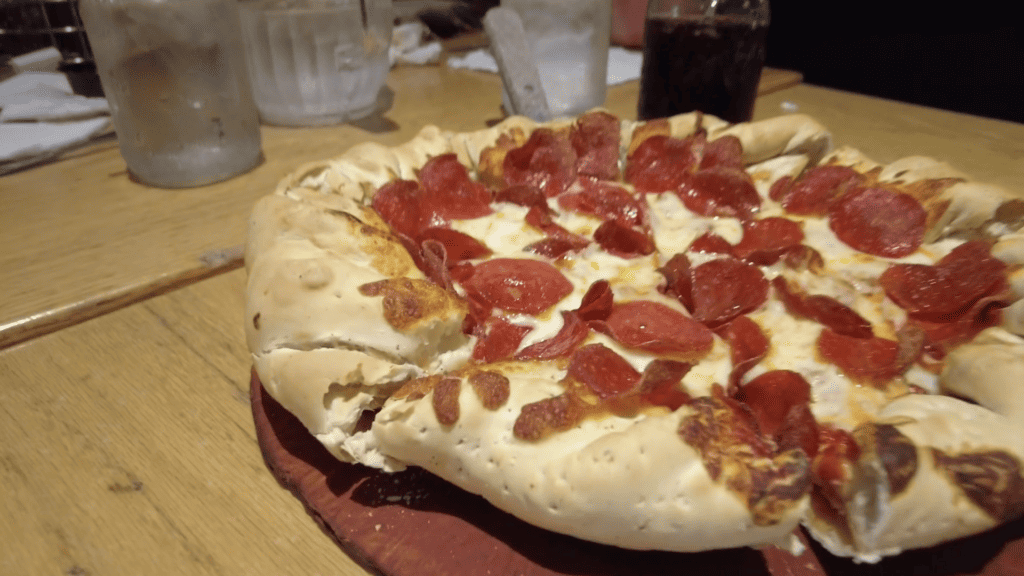 photo of a Colorado style pizza, also called a Mountain Pie, with pepperoni and bacon.